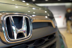The logo of Honda Motor Company attached to a vehicle is seen at a showroom in Tokyo on May 13, 2022. Honda is expanding the use of hydrogen to include trucks and construction equipment, electricity for buildings and even outer space, not just cars on the roads. Honda Motor Co. plans a new fuel cell vehicle for sale in 2024, packed with a fuel cell stack developed with General Motors Co. of the U.S., its general manager, Testsuya Hasebe, told reporters Thursday, Feb. 2, 2023.