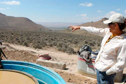 Melissa Boerst, a Lithium Nevada Corp. geologist, points to an area of future exploration from a drill site at the Thacker Pass Project in Humboldt County, Nev., on Sept. 13, 2018. A federal judge on Monday, Feb. 6, 2023, ordered the government to revisit part of its environmental review of a lithium mine planned in Nevada but denied opponents' effort to block the project in a ruling the developer says clears the way for construction at the largest known U.S. lithium deposit.