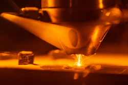 3D-printing technologies like Laser Engineered Net Shaping, shown here, are helping scientists at Sandia National Laboratories rapidly discover, prototype and test new materials.