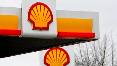 Signs at a shell petrol station in London, Thursday, Feb. 2, 2023. Global energy giant Shell says annual profits doubled to a record high last year as oil and gas prices soared after Russia's invasion of Ukraine. London-based Shell Plc on Thursday posted adjusted earnings of $39.9 billion for 2022 and $9.8 billion in the fourth quarter.