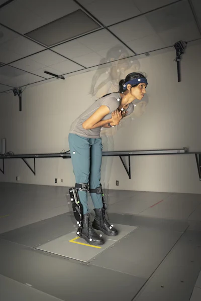 In this composite time series image, a test subject wearing a robotic lower-limb exoskeleton pitches forward but doesn’t need to step to maintain her balance.