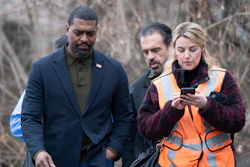 Environmental Protection Agency Administrator Michael Regan left, walks with his staff through East Palestine, Ohio on Thursday, Feb. 16, 2023.