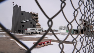 The Denver Fire Academy is visible through a fence from the road Thursday, Feb. 23, 2023, in Commerce City, Colo. Firefighting foam used here up until 2018 is suspected to be linked to the discovery of PFAS, or “forever chemicals” found in city’s groundwater.