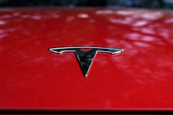 A Tesla logo is seen on a vehicle on display in Austin, Texas, Wednesday, Feb. 22, 2023.