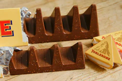 Two bars of the Toblerone Swiss chocolate are shown, at front is the new style 150 gram bar showing the reduction in triangular pieces, in the background is the older style 360 gram bar, pictured in London, on Nov. 8, 2016.