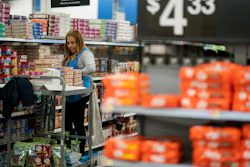 A worker organizes items at a Walmart Supercenter in North Bergen, N.J., Feb. 9, 2023.