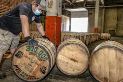 Green River Distilling Co. employee Coleman Savage looks over the 300,000th barrel of bourbon filled at the distillery inside the new-fill warehouse at the plant on April 20, 2021, in Owensboro, Ky.