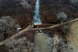 In this photo taken by a drone, cleanup continues in the area where the ruptured Keystone pipeline dumped oil into a creek in Washington County, Kan., Dec. 9, 2022.