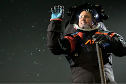 Axiom Space chief engineer Jim Stein demonstrates a prototype spacesuit, Wednesday, March 15, 2023, in Houston.