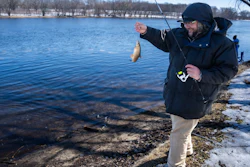 Tyler Abayare catches a red horse carp on the Mississippi River at the Montissippi County Park downriver from the Xcel Energy nuclear power plant in Monticello, Minn., on Friday, March 24, 2023. Abayare fishes at this spot everyday and noticed increased activity including people taking water samples around three times a week in the last 60 days.