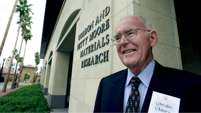 Intel Corp. founder and chairman emeritus, Gordon Moore, smiles as he tours during the dedication of the new Gordon and Betty Moore Material Research building at Stanford University on the Stanford, Calif., campus, Wednesday, Oct. 11, 2000.