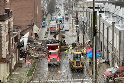 Emergency responders and heavy equipment are seen at the site of a deadly explosion at a chocolate factory in West Reading, Pennsylvania, Saturday, March 25.