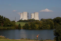 A man fishes with the towering Dukovany nuclear power plant in the background, in Dukovany, Czech Republic, Sept.. 27, 2011. The Czech Republic’s major power company signed a deal on Wednesday, March 29, 2023 with U.S. Westinghouse Electric Co. to deliver fuel supplies for the Dukovany nuclear plant, erasing the country’s dependence on Russia.