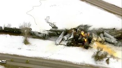 This photo provided KSTP, emergency personnel respond to the scene of a train derailment early Thursday, March 30, 2023 in Raymond, Min.