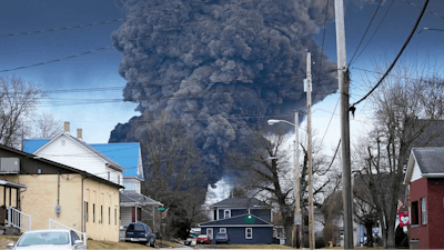 A black plume rises over East Palestine, Ohio, as a result of a controlled detonation of a portion of the derailed Norfolk Southern trains, Feb. 6, 2023.