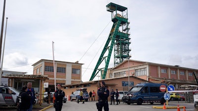 Catalan police cordon off the area at the entrance of the Cabanasses de Súria mine around 80 kilometers (50 miles) northwest of Barcelona, Spain, Thursday, March 9, 2023. Three workers died after becoming trapped deep underground in a potash mine in northeastern Spain on Thursday, firefighters said.