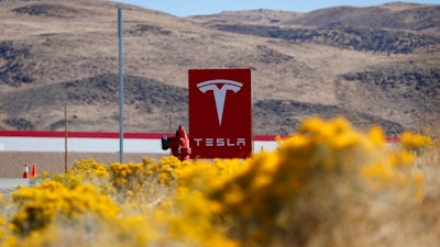 A sign marks the entrance to the Tesla Gigafactory, Oct. 13, 2018, in Sparks, Nev. Tesla will get more than $330 million in tax breaks from Nevada to massively expand its vehicle battery facility east of Reno and add a new electric semi-truck factory. Approval on Thursday, March 2, 2023, from the Governor's Office of Economic Development came as Republican Gov. Joe Lombardo cited the benefit of jobs and the boost that Tesla's huge Gigafactory has given the local economy for almost a decade.