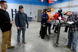 Payton Lane, 19, left, and Boone Williams, 20, talk during a second-year apprentice training program class at the Plumbers and Pipefitters Local Union 572 facility in Nashville, Tenn., on Thursday, Feb. 2, 2023.