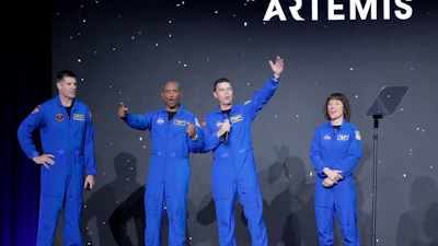 From left, Jeremy Hansen, Victor Glover, Reid Wiseman and Christina Hammock Koch, celebrate on stage as they are announced as the Artemis II crew during a NASA ceremony naming the four astronauts who will fly around the moon by the end of next year, at a ceremony held in the NASA hangar at Ellington airport Monday, April 3, 2023, in Houston.