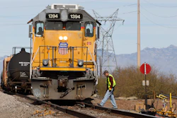 The crew on a Union Pacific freight train works at a siding area on Jan. 24, 2020, south of Tucson, Ariz.