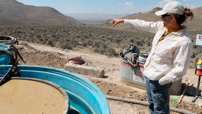 Melissa Boerst, a Lithium Nevada Corp. geologist, points to an area of future exploration from a drill site at the Thacker Pass Project in Humboldt County, Nev., Sept. 13, 2018.