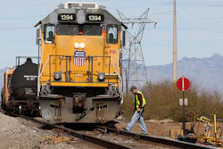 The crew on a Union Pacific freight train works at a siding area south of Tucson, Ariz., Jan. 24, 2020.