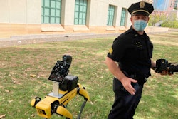Honolulu Police Acting Lt. Joseph O'Neal demonstrates a robotic dog in Honolulu, Friday May 14, 2021. New York City officials unveiled three new high-tech policing devices Tuesday, including a similar robotic dog that critics called creepy when it first joined the police pack 2 1/2 years ago.
