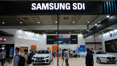 People walk by Samsung SDI Co.' booth during the InterBattery 2021, the country's leading battery exhibition, at COEX in Seoul, South Korea, on June 9, 2021. General Motors and South Korea’s Samsung SDI plan to invest more than $3 billion in building a new electric vehicle battery cell plant in the United States, the companies said Tuesday, April 25, 2023.