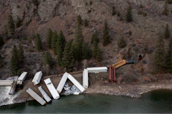 A train sits derailed near Quinn's Hot Springs Resort west of St. Regis, Mont., Sunday, April 2, 2023.