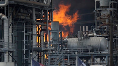 A fire burns at a Shell chemical facility in Deer Park, Friday, May 5, 2023 east of Houston.