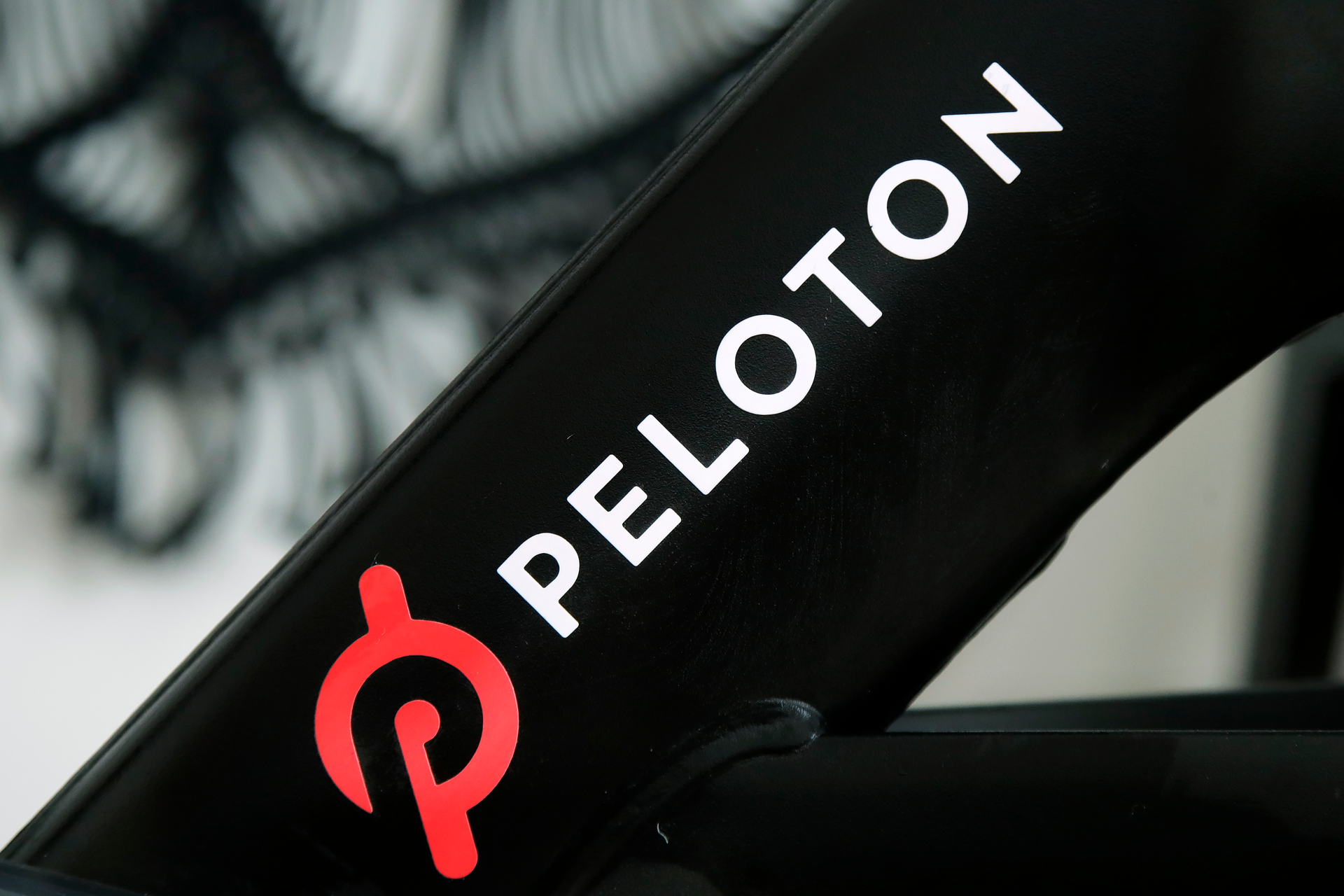 A Peloton logo is seen on the company's stationary bicycle on Nov. 19, 2019, in San Francisco, Calif.