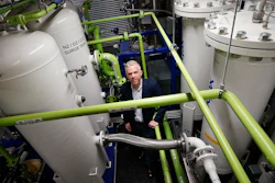 Brian Asparro, chief operating officer of CarbonQuest, stands in a production room where liquid carbon dioxide is converted from a byproduct of a natural gas fired water boiler to a salable industrial product, Tuesday, April 18, 2023, in New York.
