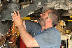 Mechanic Jon Guthrie inspects the underside of a 2014 Honda Ridgeline pickup truck at Japanese Auto Professional Service in Ann Arbor, Michigan.