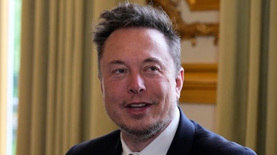 Elon Musk poses prior to his talks with French President Emmanuel Macron, May 15, 2023 at the Elysee Palace in Paris.