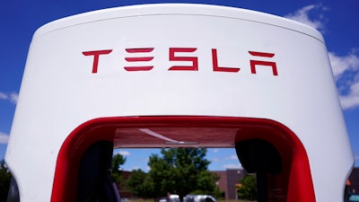 A Tesla Supercharger is seen at Willow Festival shopping plaza parking lot, Aug. 10, 2022, in Northbrook, Ill.