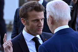 France's President Emmanuel Macron, left, speaks with U.S. President Joe Biden before a family photo of leaders of the G7 and invited countries during the G7 Leaders' Summit in Hiroshima, western Japan, Saturday, May 20, 2023.