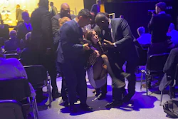 Protesters who tried to storm the stage are taken out of the Excel centre in east London during oil giant Shell's annual general meeting in London, Tuesday, May 23, 2023.