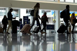 Travelers walk through a domestic terminal at San Francisco International Airport in San Francisco, Friday, May 26, 2023. On Wednesday, the Conference Board reports on U.S. consumer confidence for May.