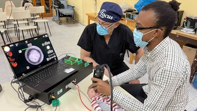 Doctors practicing imaging using the model eye on-site in Haiti.