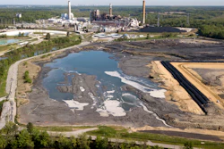 The Richmond city skyline can be seen on the horizon behind the coal ash ponds along the James River near Dominion Energy's Chesterfield Power Station in Chester, Va., Tuesday, May 1, 2018.