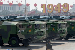Military vehicles carry an earlier version of China’s hypersonic missile during a 2019 parade.