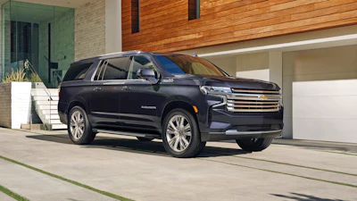 This photo provided by General Motors shows the 2023 Chevrolet Suburban, a large three-row SUV that is an Edmunds top pick.