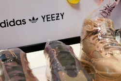 A sign advertises Yeezy shoes made by Adidas at Kickclusive, a sneaker resale store, in Paramus, N.J., Tuesday, Oct. 25, 2022.