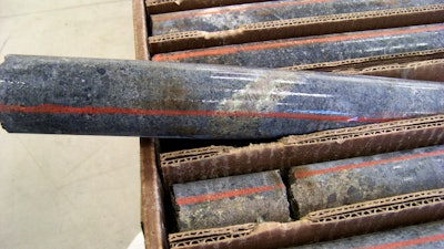 A core sample drilled from underground rock near Ely, Minn., shows a band of shiny minerals on Oct. 4, 2011, containing copper, nickel and precious metals, center, that Twin Metals Minnesota LLC hopes to mine near the Boundary Waters Canoe Area Wilderness in northeastern Minnesota.