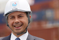 U.S. Secretary of Transportation Pete Buttigieg reacts as he was walking around the Yokohama Port during a tour which includes a visit to a construction site for a new pier that will accommodate larger ships coming from the U.S. on Monday, June 19, 2023, in Tokyo.