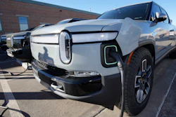 A 2023 R1T pickup truck is charged in a bay at a Rivian delivery and service center Wednesday, Feb. 8, 2023, in Denver.