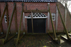 Support beams stabilize an historic farm in Hunzinge, northern Netherlands, on Jan. 19, 2018.