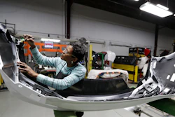 Mary Skinner inspects the rear end of a General Motors Chevrolet Cruze at Jamestown Industries in Youngstown, Ohio on Nov. 28, 2018.