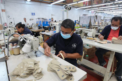 A man works in a shoe maquiladora or factory, in Leon, Mexico, Monday, Feb. 7, 2023.
