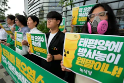 Environmental activists protest against the Japanese government's decision to release treated radioactive wastewater from the wrecked Fukushima nuclear power plant, near a building which houses the Japanese Embassy in Seoul, South Korea, Friday, June 30, 2023.
